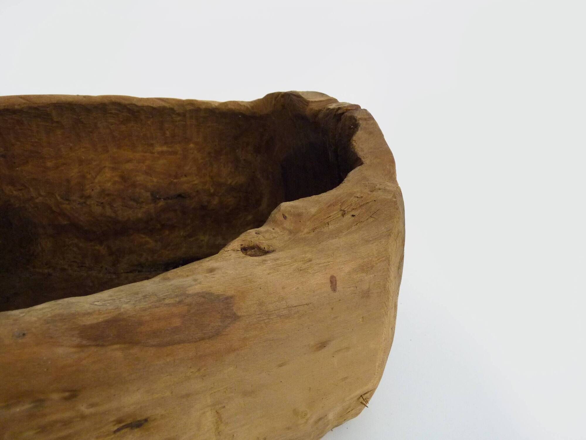 Old wooden farm water trough. Centerpiece, floral decoration. 1950