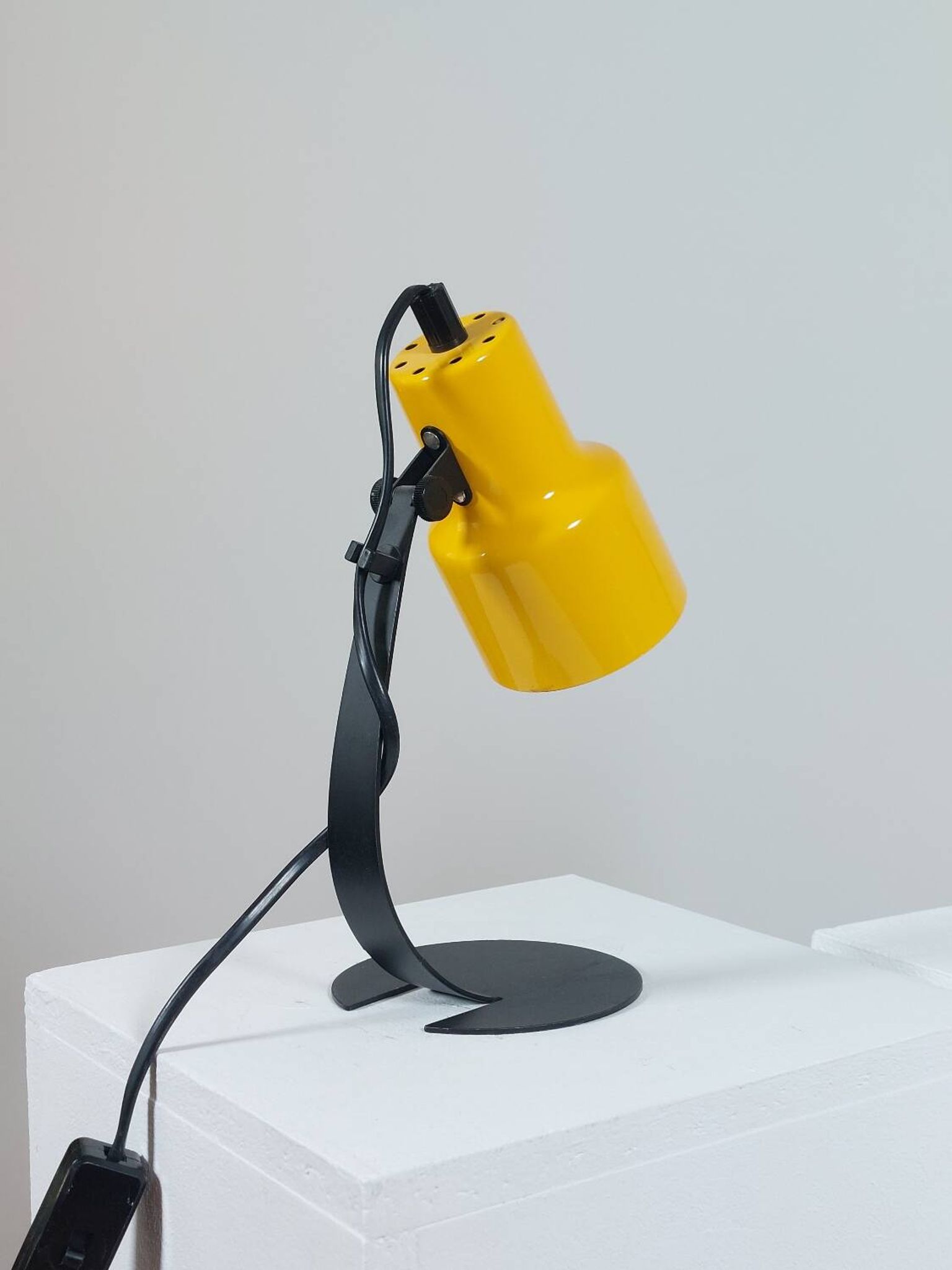 A pair of well-designed minimalist bedside lamps.