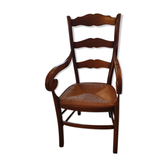 Chair with armrests in wood and seat rattan