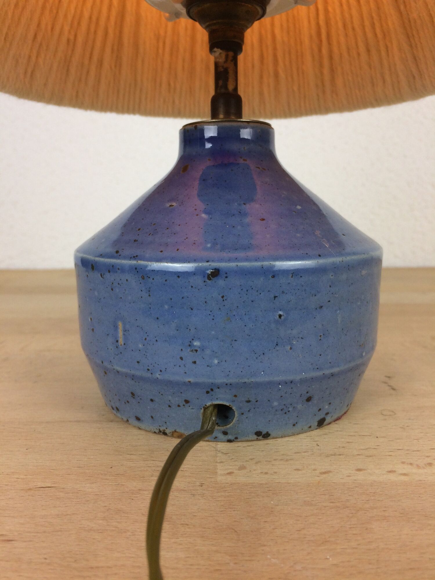Blue ceramic lamp foot and white wool lampshade