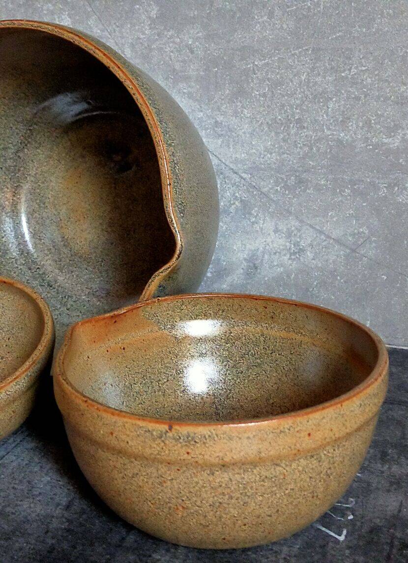 Three nesting pottery salad bowls in glazed stoneware