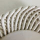 Covered basket in white woven ceramic and fruit slip.