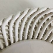 Covered basket in white woven ceramic and fruit slip.