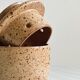 Small speckled ceramic butter dish, hand-painted decoration.