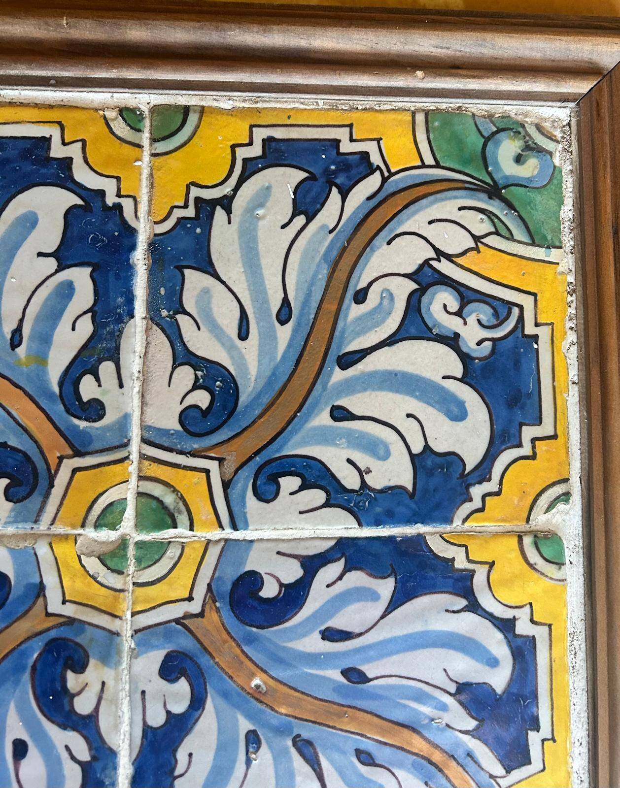 Panel of four Catalan tiles, 17th century, framed.
