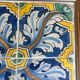 Panel of four Catalan tiles, 17th century, framed.