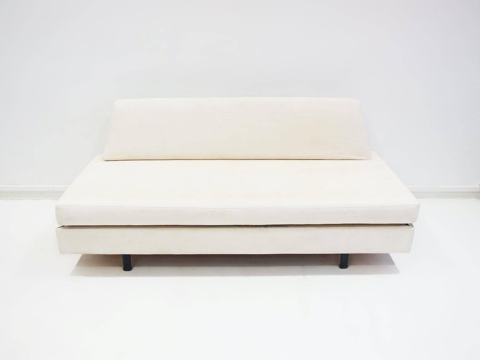 Italian modernist daybed with white upholstery and iron frame.