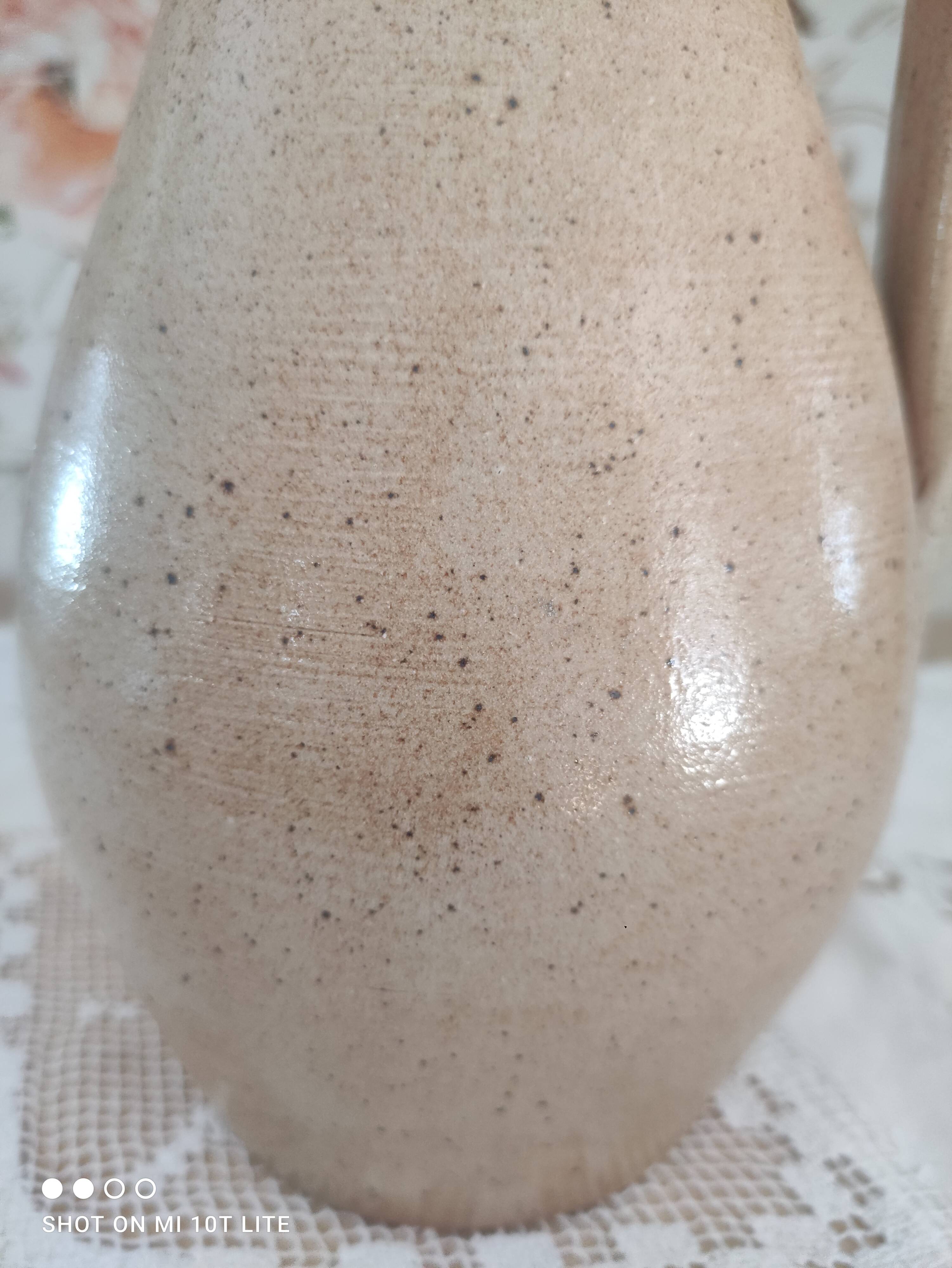 Vintage pitcher in light brown sandstone speckled