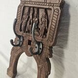 Coat rack with 2 hooks on a frieze of divinities in teak