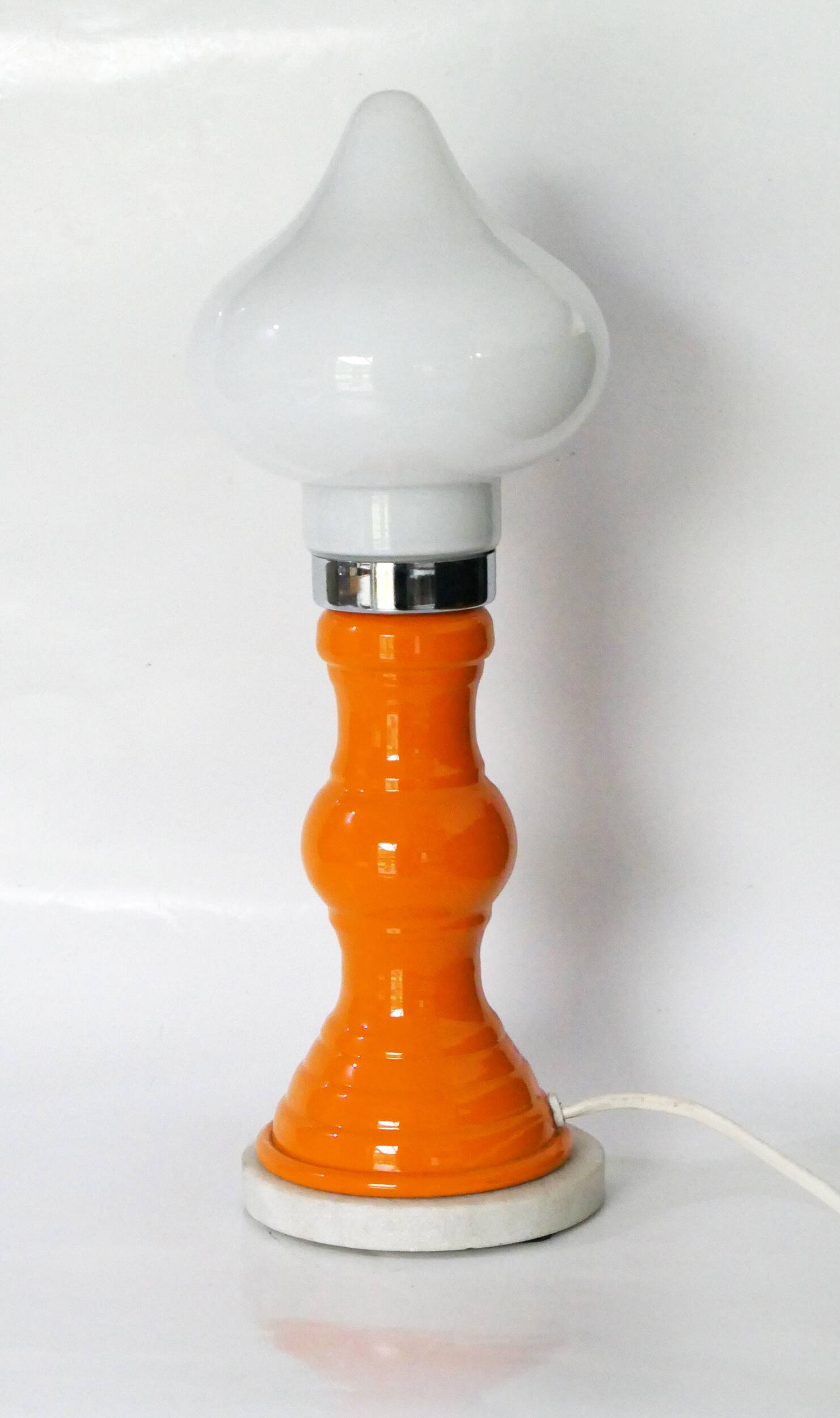 Table lamp or bedside lamp from the 1960s-70s in orange and chrome.