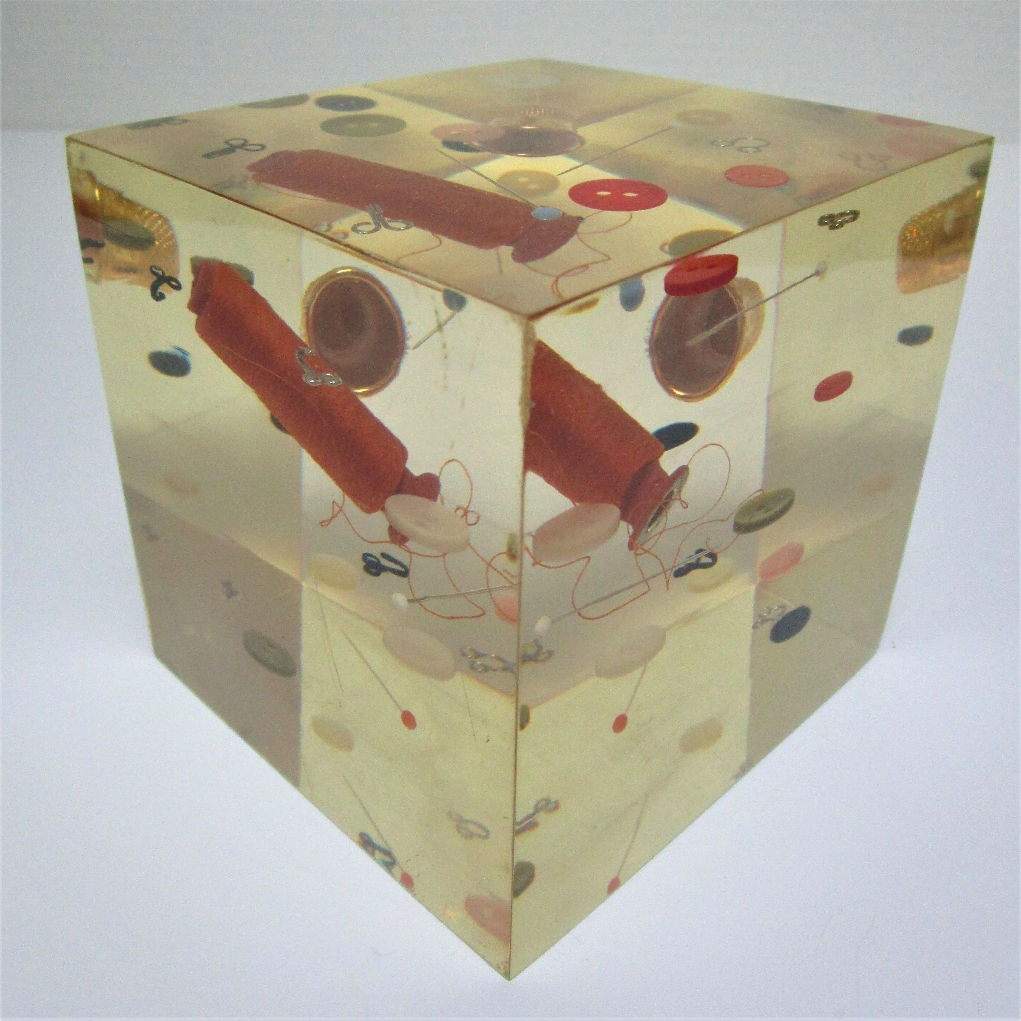 Paperweight sculpture block resin inclusions sewing design 70s