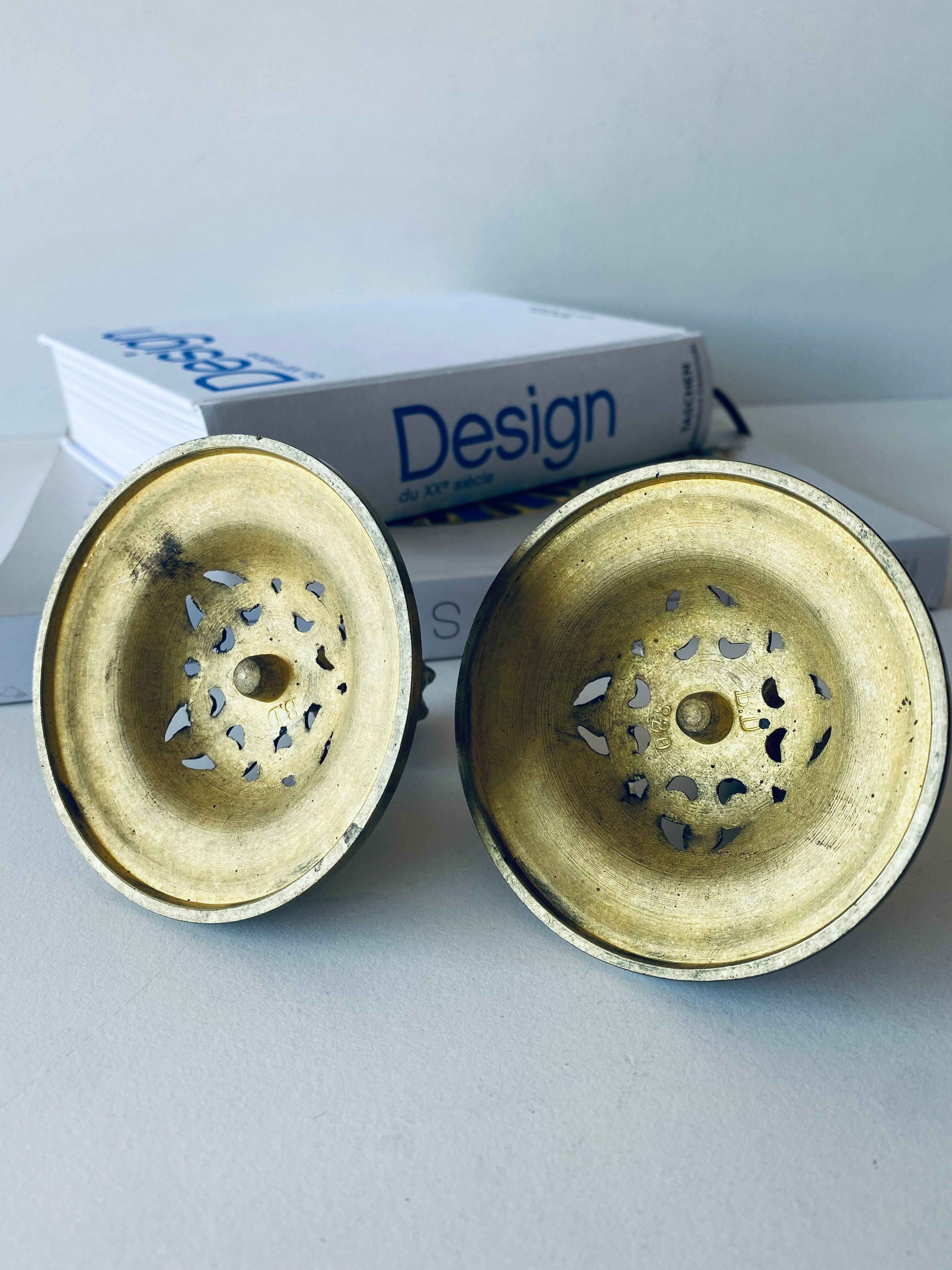 Pair of bronze candle holders signed