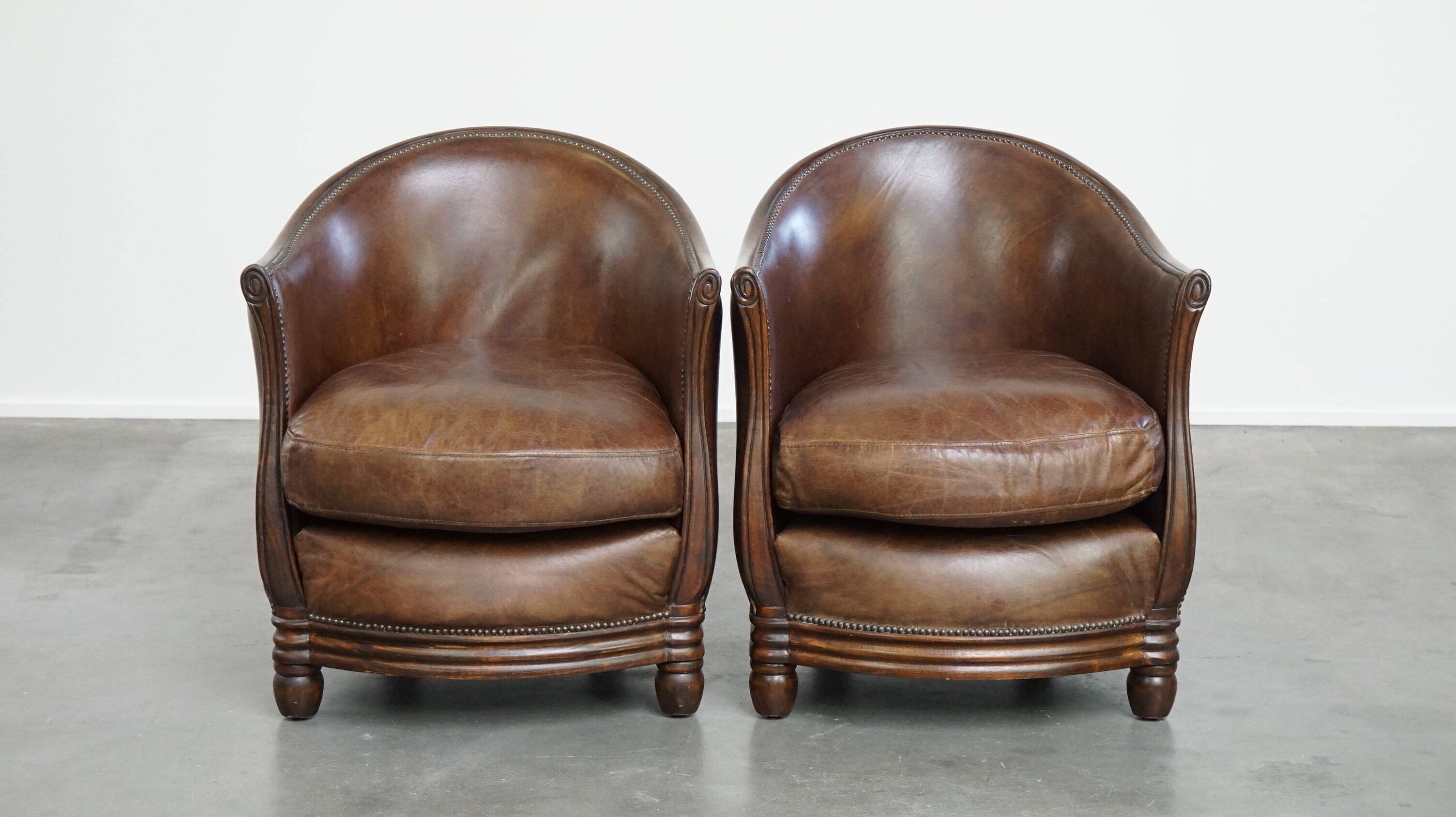 Set of 2 club chairs/armchairs in dark cognac leather