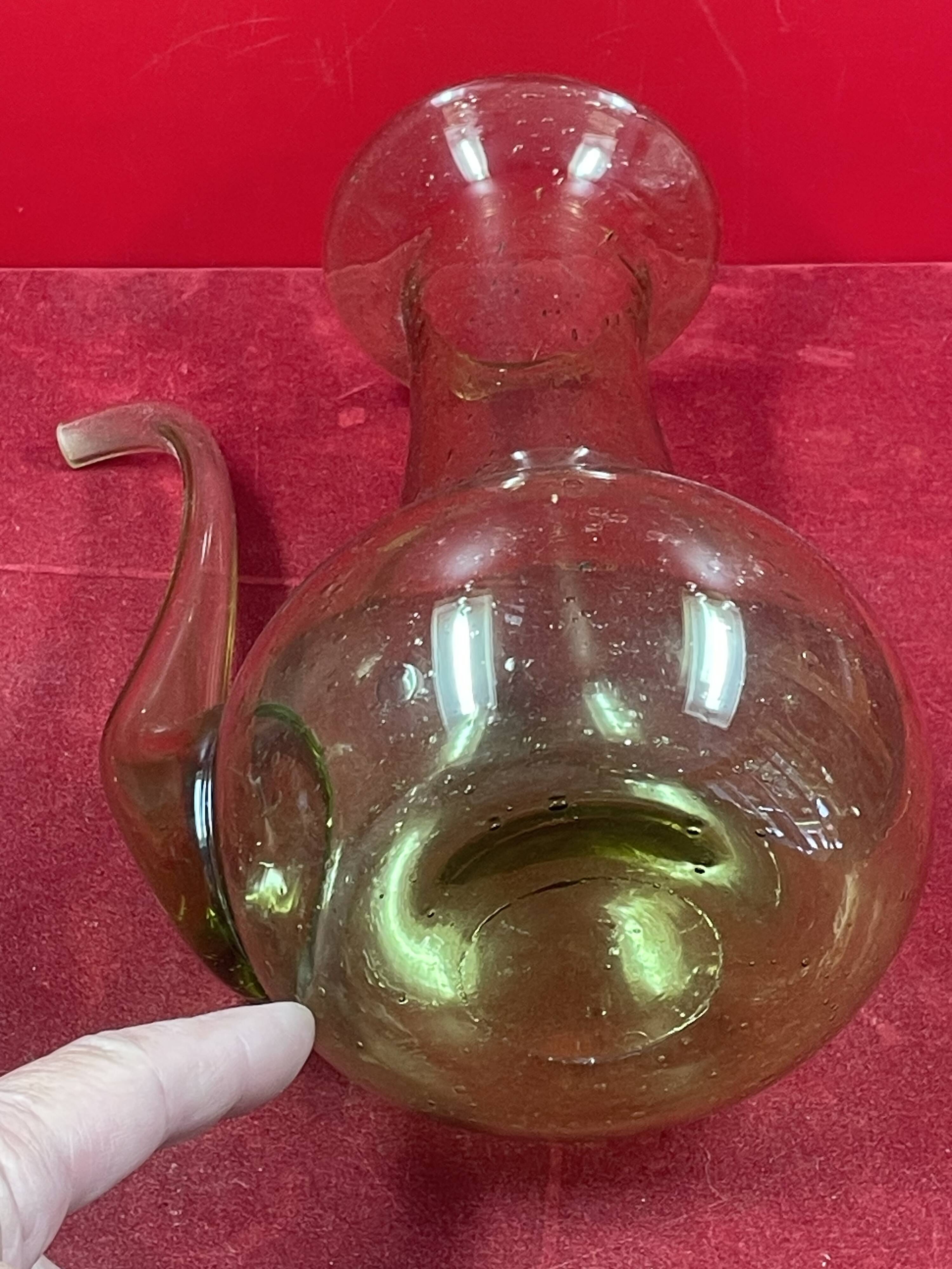 Design decanter, pourer in glassware of biot green vintage glass