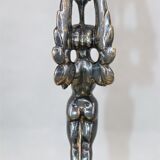 Pair of candle holders in gilded bronze and patinated with a candle