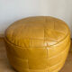 2 poufs moutarde patchwork en cuir de Sède