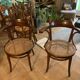 Paire de fauteuils cannés en bois courbe signés Thonet