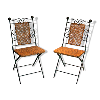 Pair of foldable chairs in wrought iron and rattan.