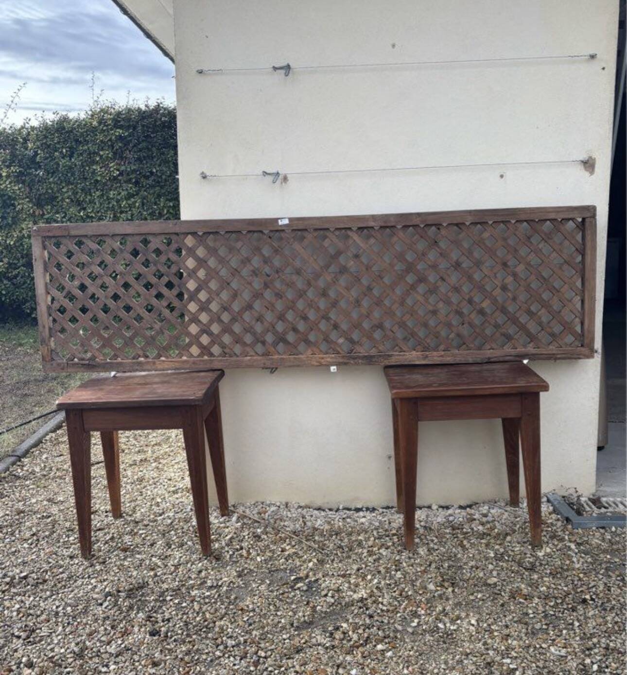 Headboard and its two wooden bedside tables.