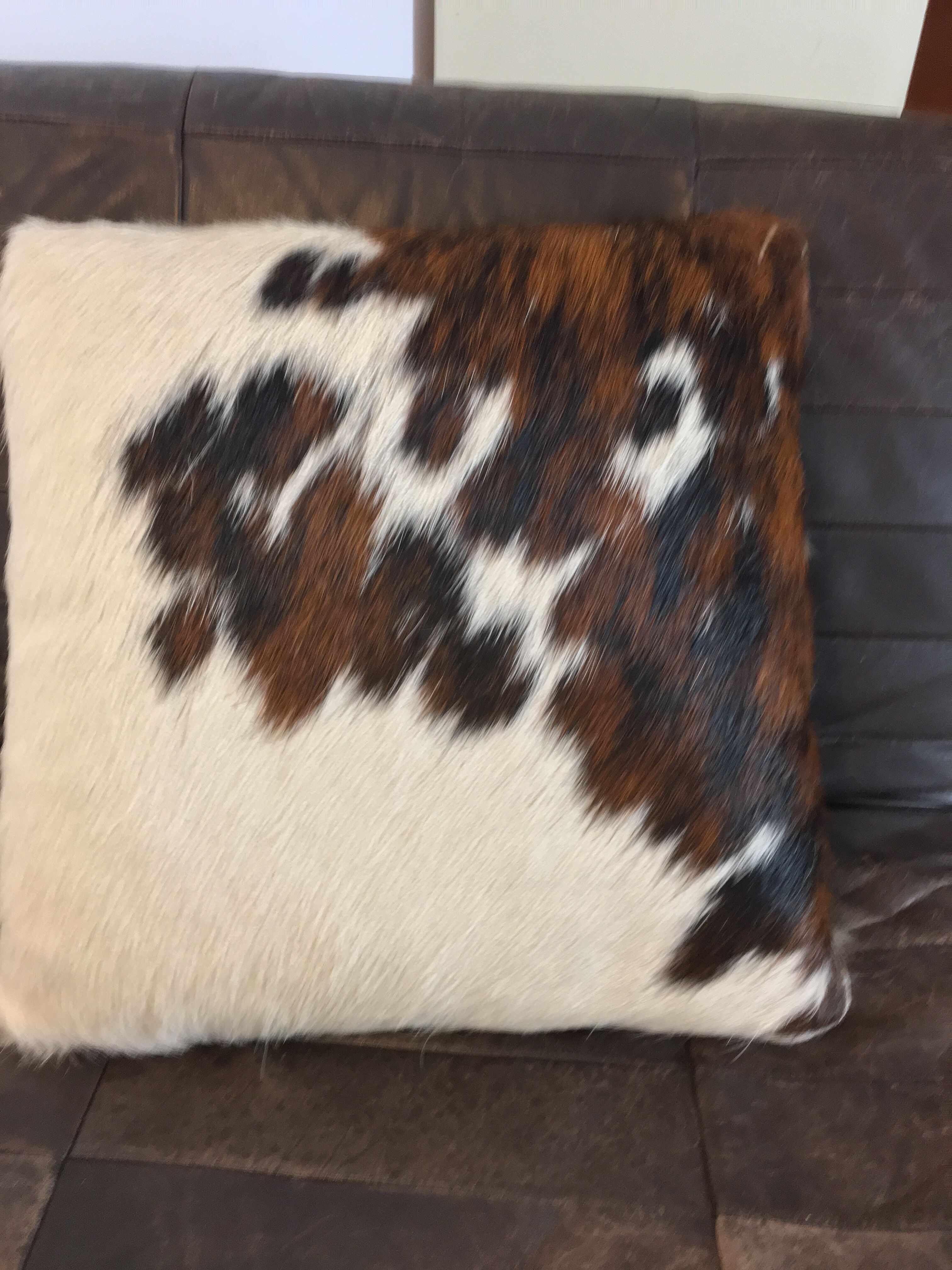 Pouf and cow cushion, leather