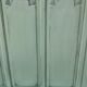 Cloakroom with sage green wall coats