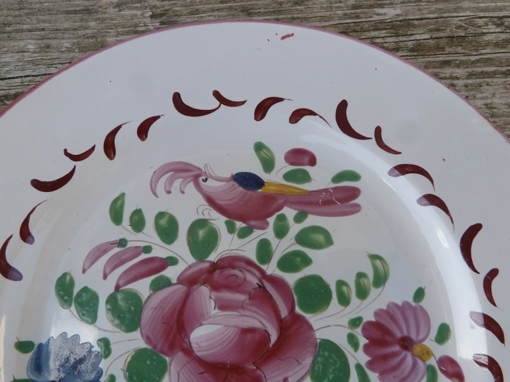 Old St Clément earthenware plate, flat plate with flower patterns.