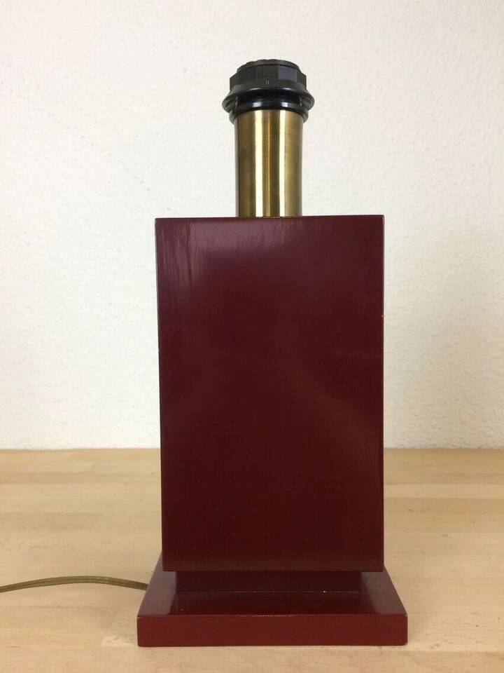 1980s vintage lamp base in red wood and gold metal.