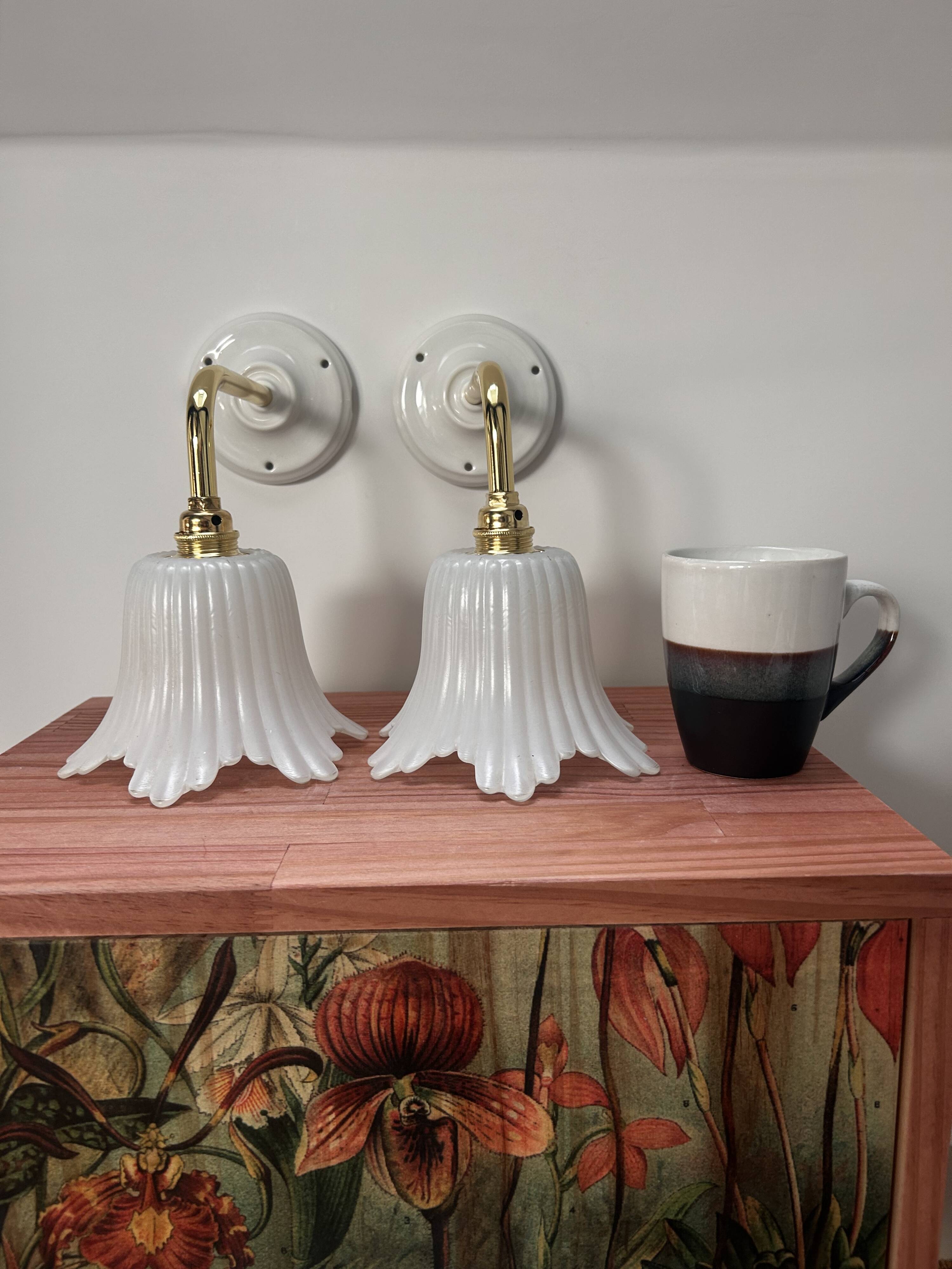 Pair of white tulip wall sconces