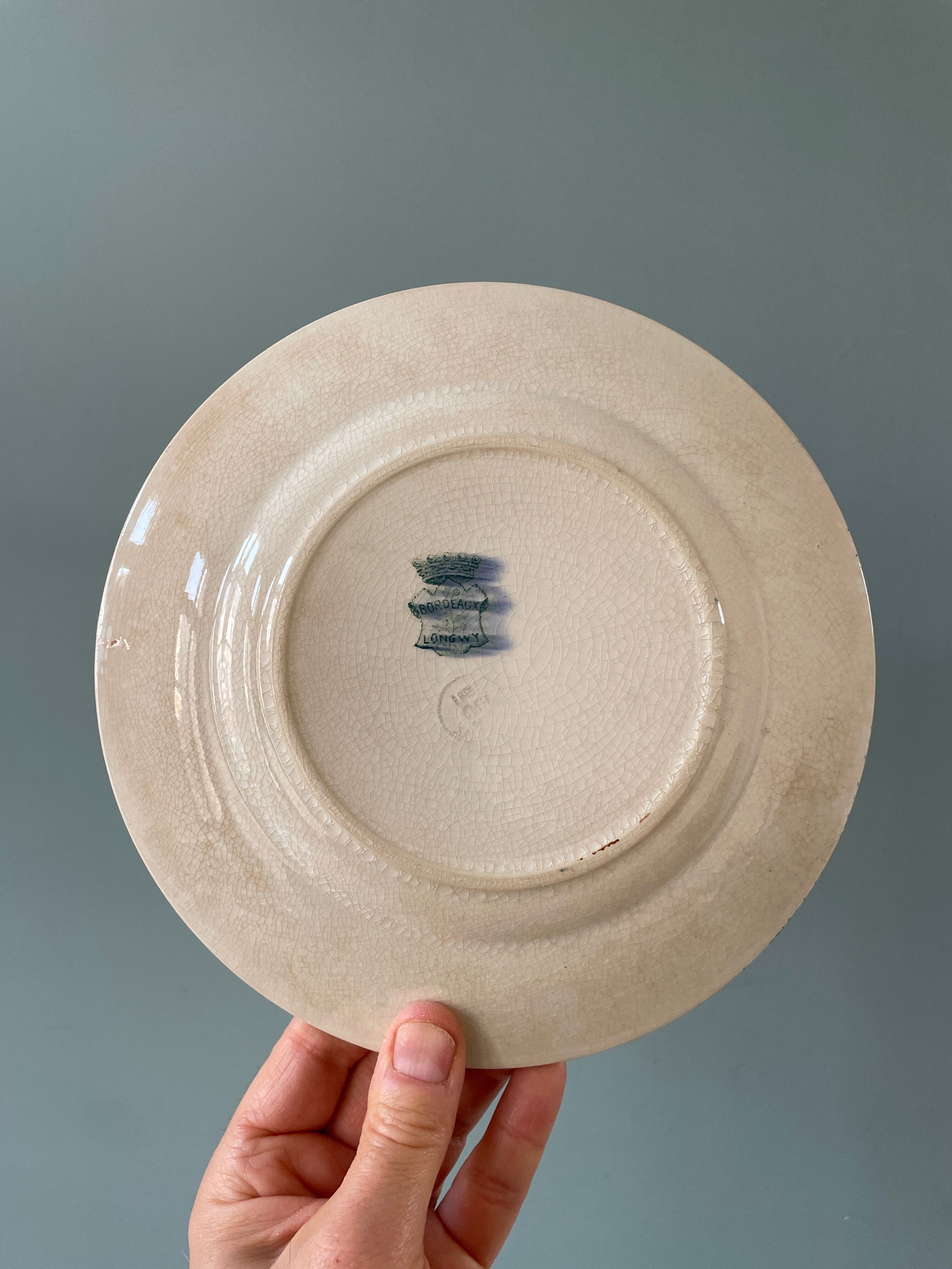 Series of 12 mismatched Terre de Fer dessert plates