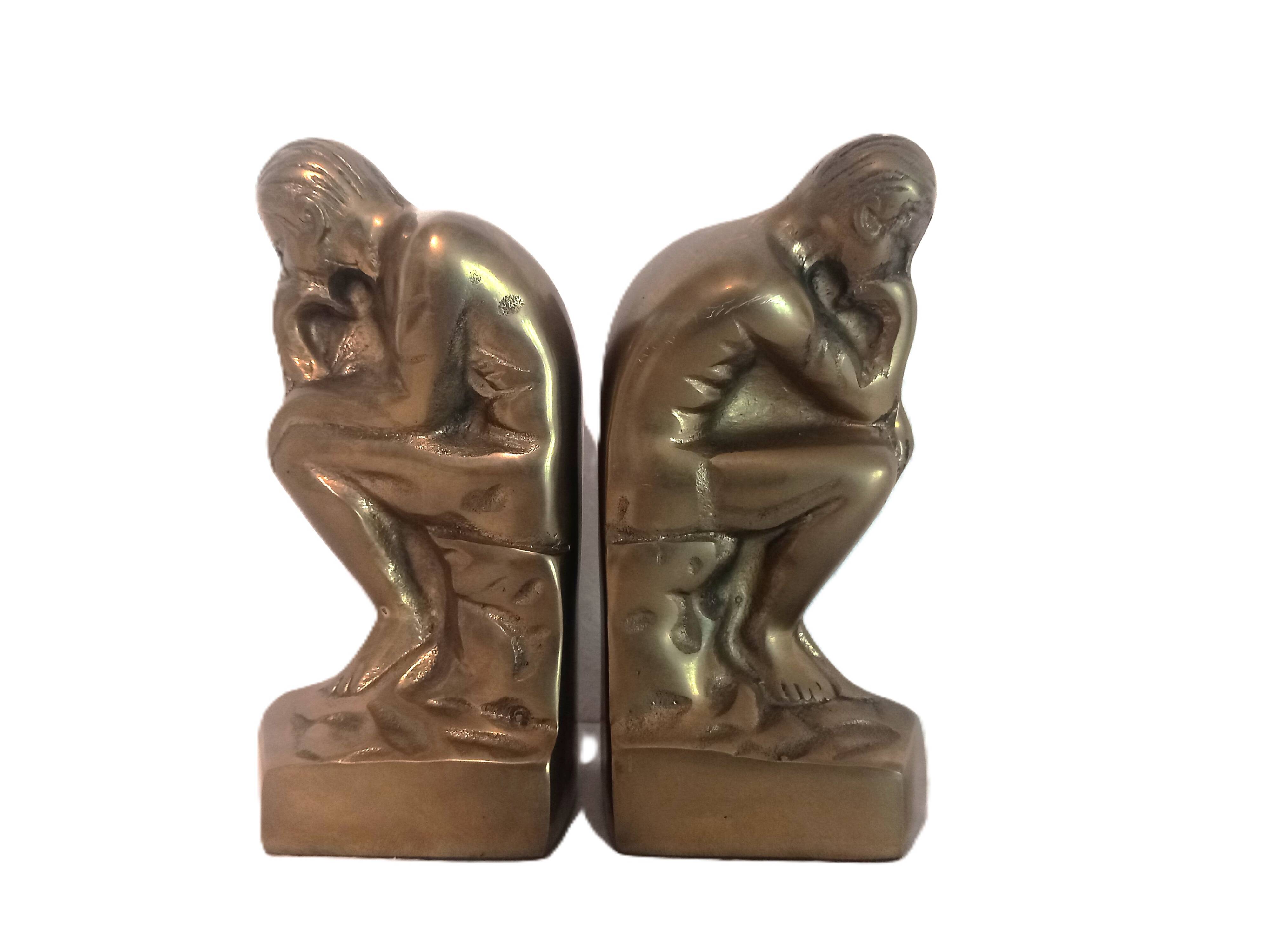 Pair of brass "thinker" bookends