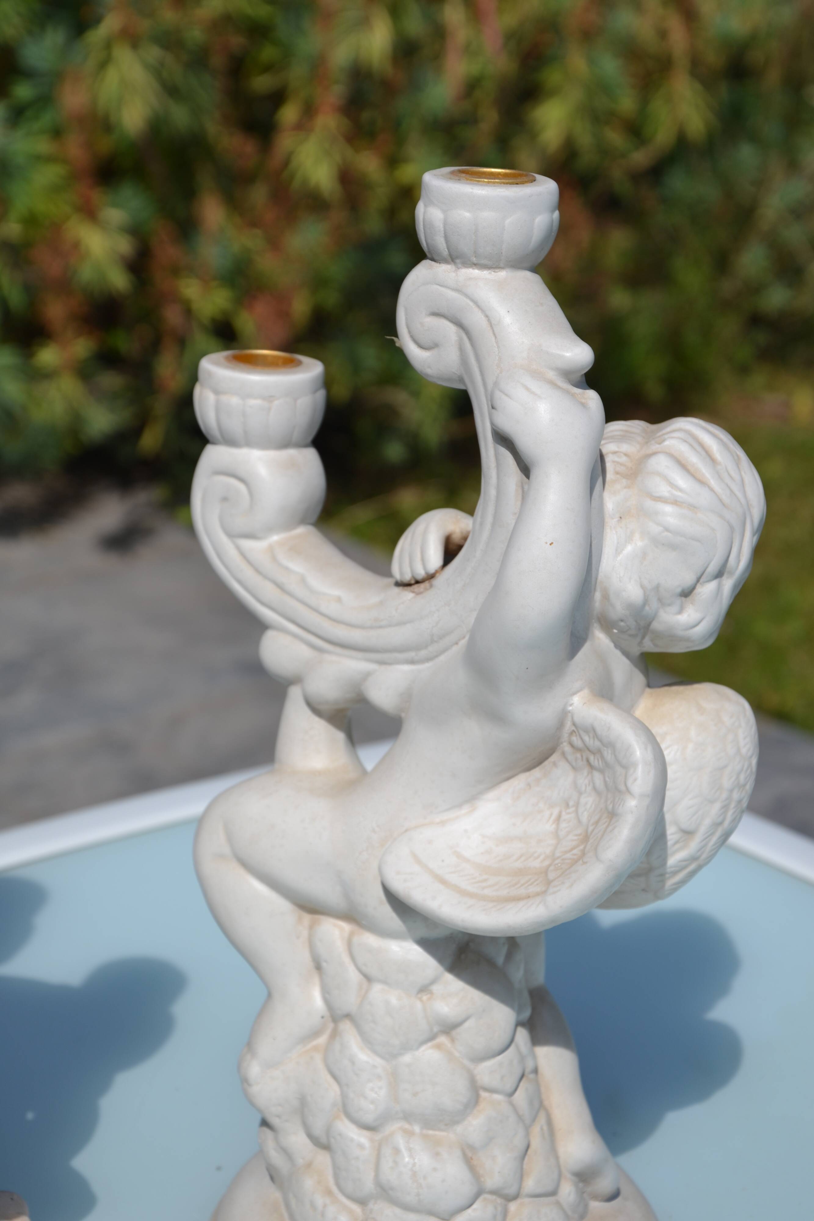 Pair of "cherub" candle holders in plaster