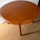 Extendable teak round table