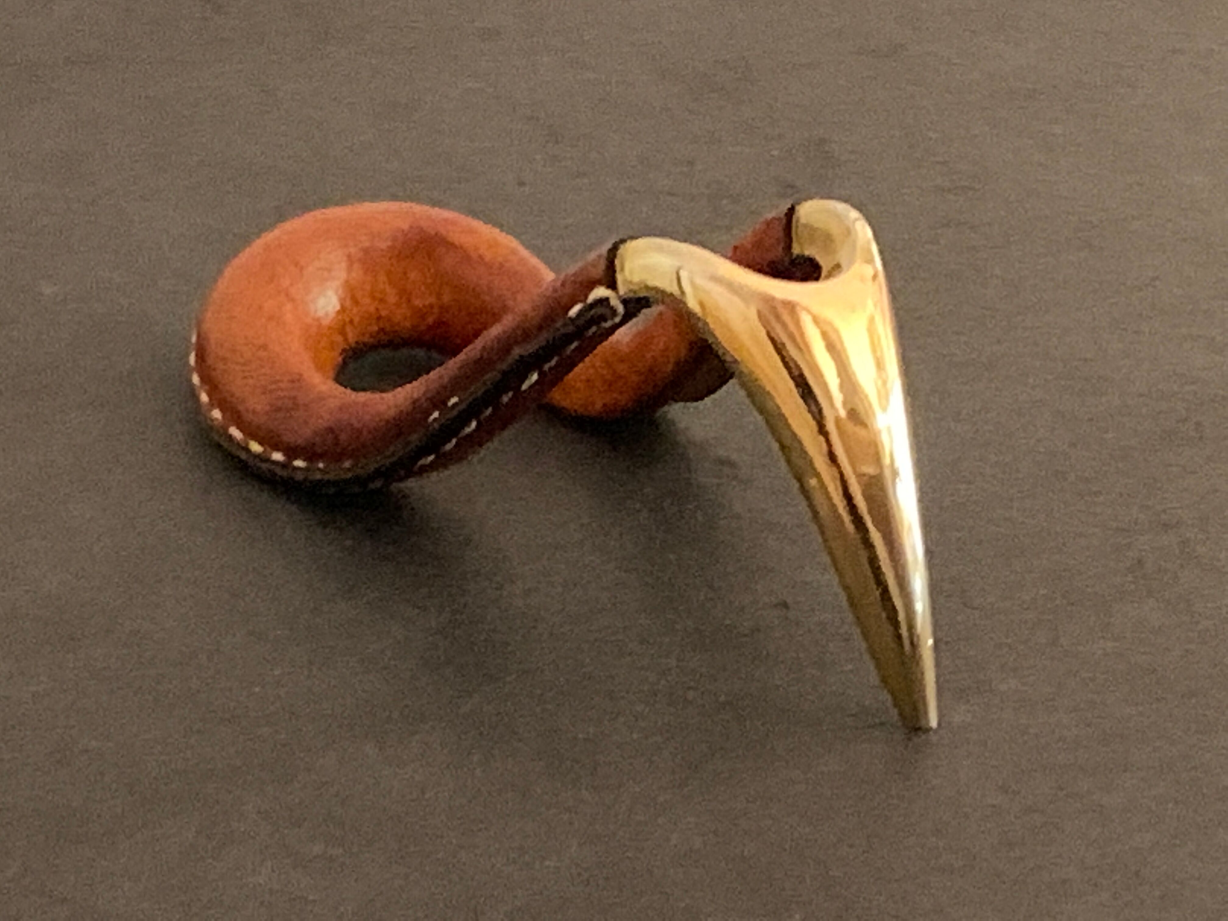 Carl Auböck pipe rack in leather and bronze, 1963