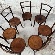 Set of 7 old Baumann bistro chairs in curved wood with round seat