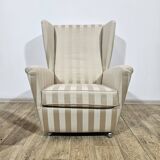 Winged armchair with footstool, 1960s.