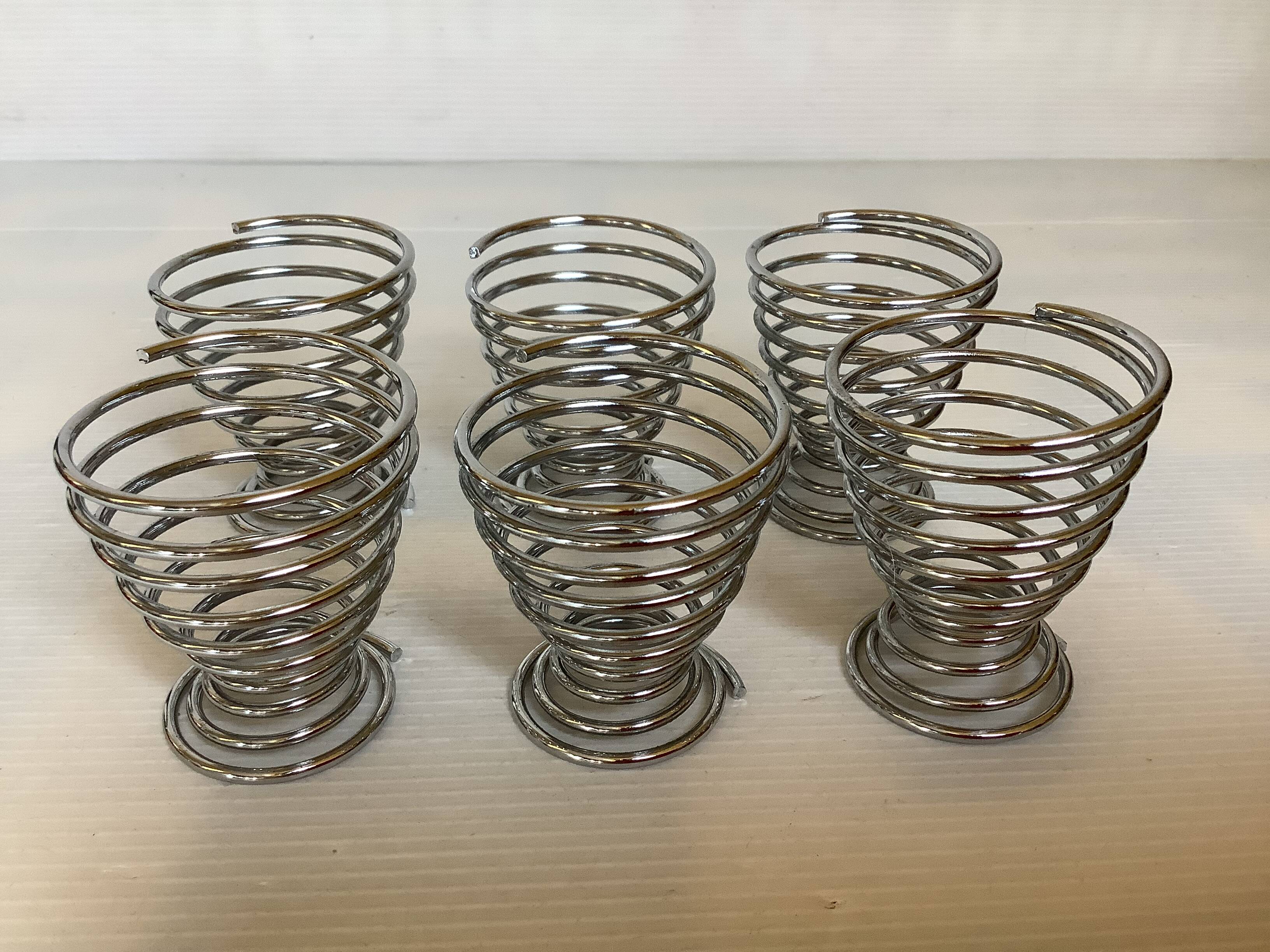 Six metal spiral egg cups