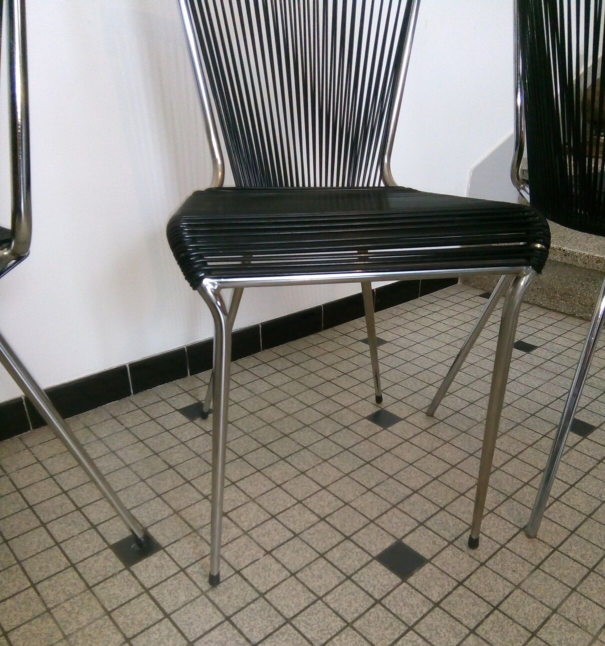 Set of black scoubidou chairs