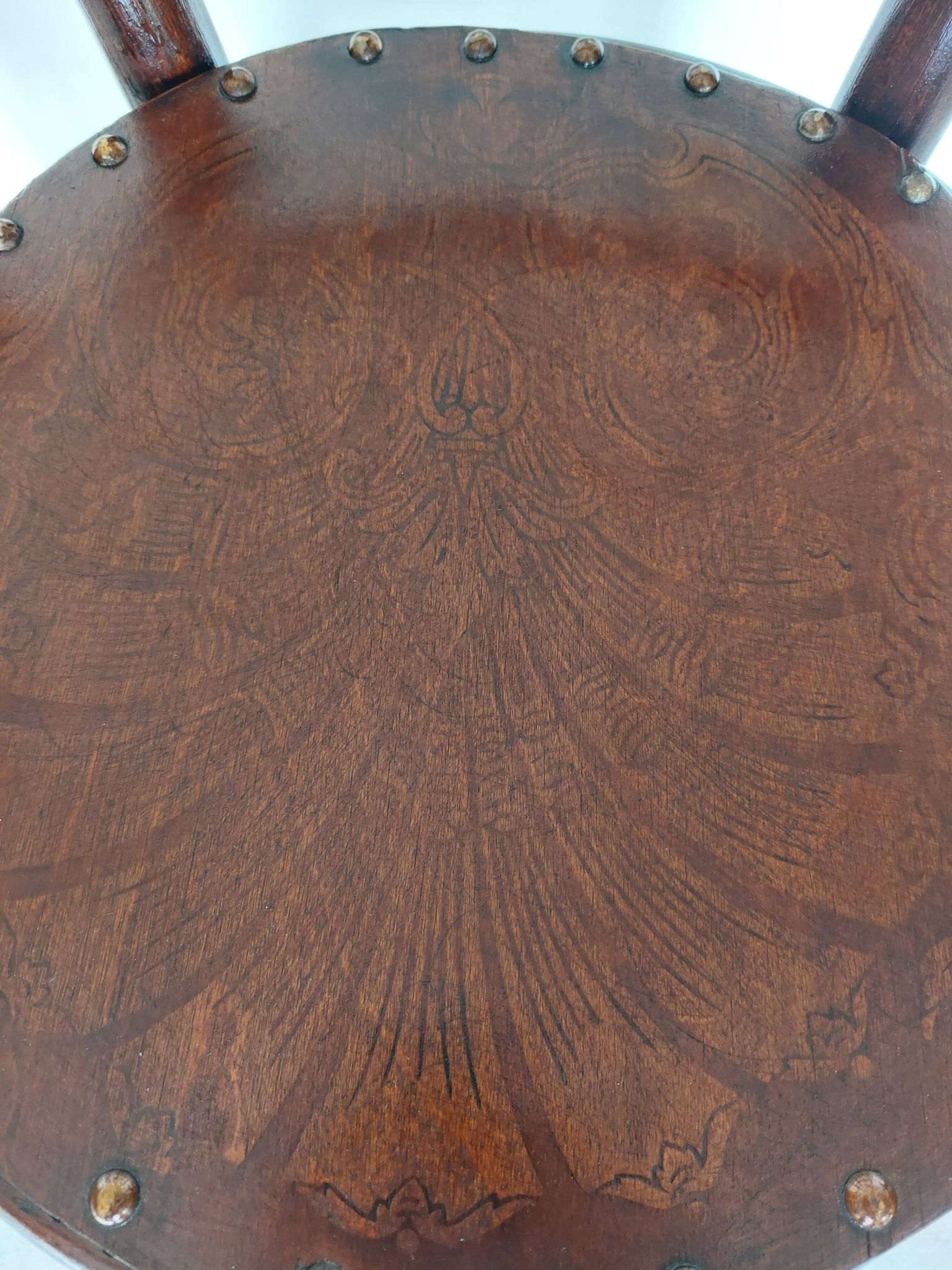 pair of round bistro chairs with a pattern on the seat, vintage