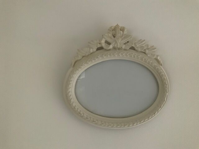 2 off-white oval plaster frames