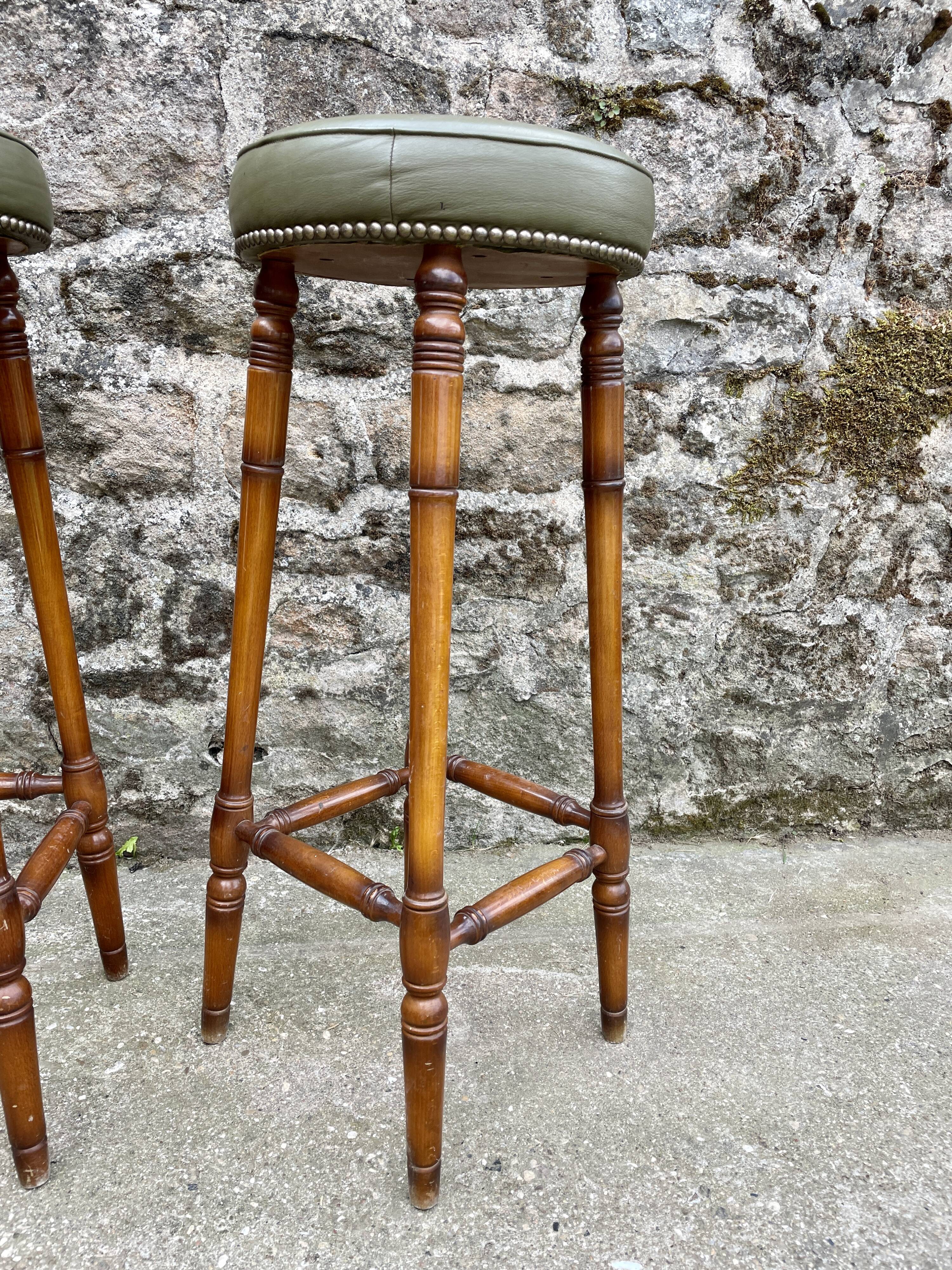 Trio of leather bar stools