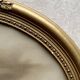 Art Deco oval frame in gilded stucco and wood