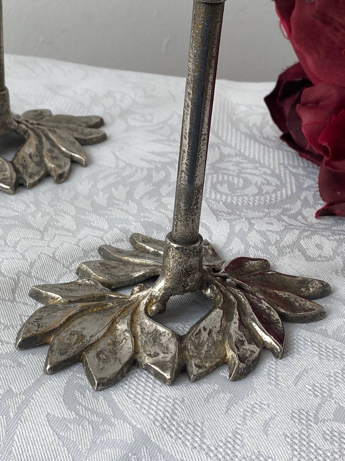 Pair of metal flower candlesticks