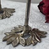 Pair of metal flower candlesticks