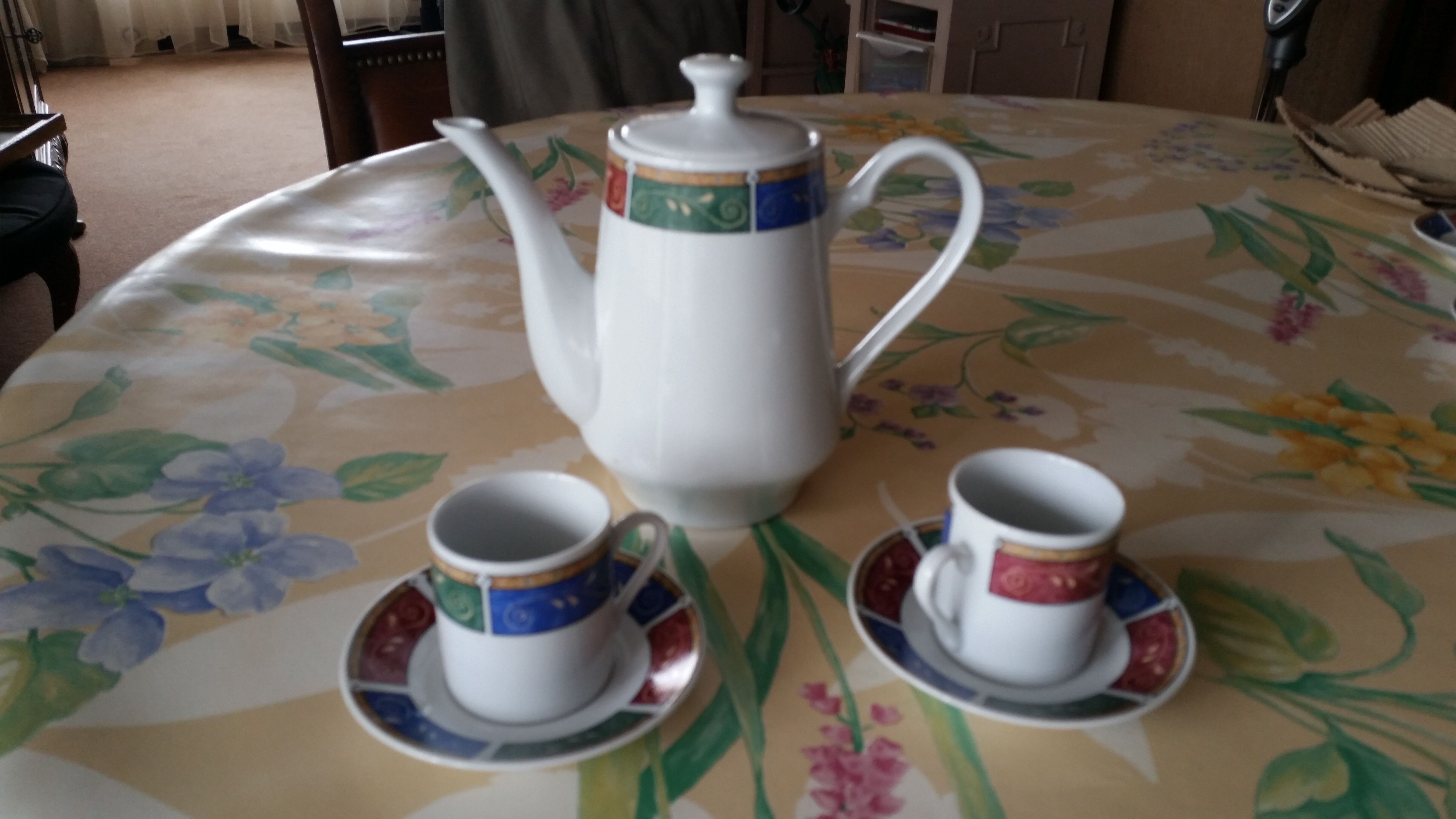 Coffee service cups saucers and coffee maker