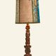 Renaissance table lamp in polychrome carved wood with cherubs.