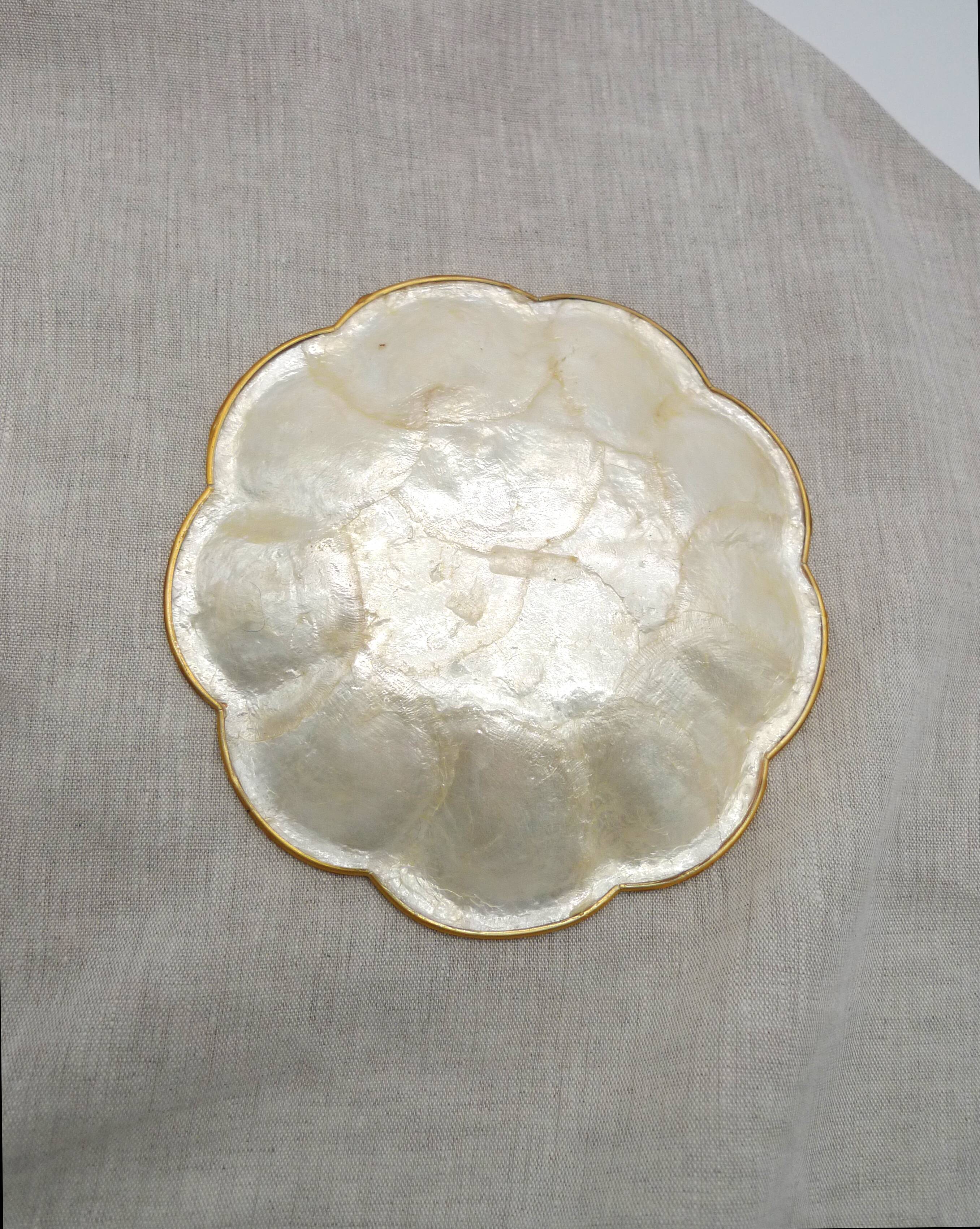 Empty pocket in mother-of-pearl and brass