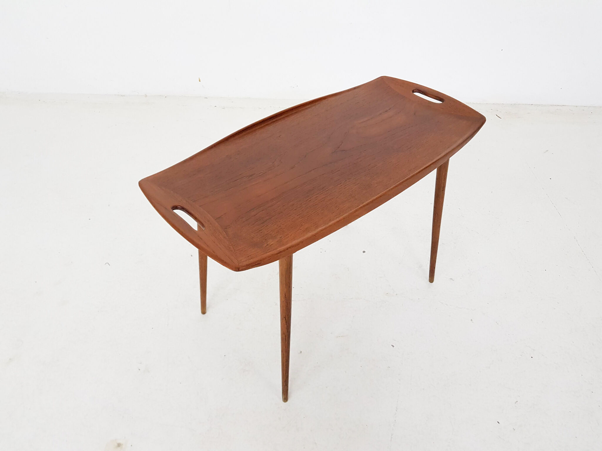 Teak side table with handles by Jens Quistgaard