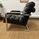 Vintage 1970s black leather armchair – metal frame