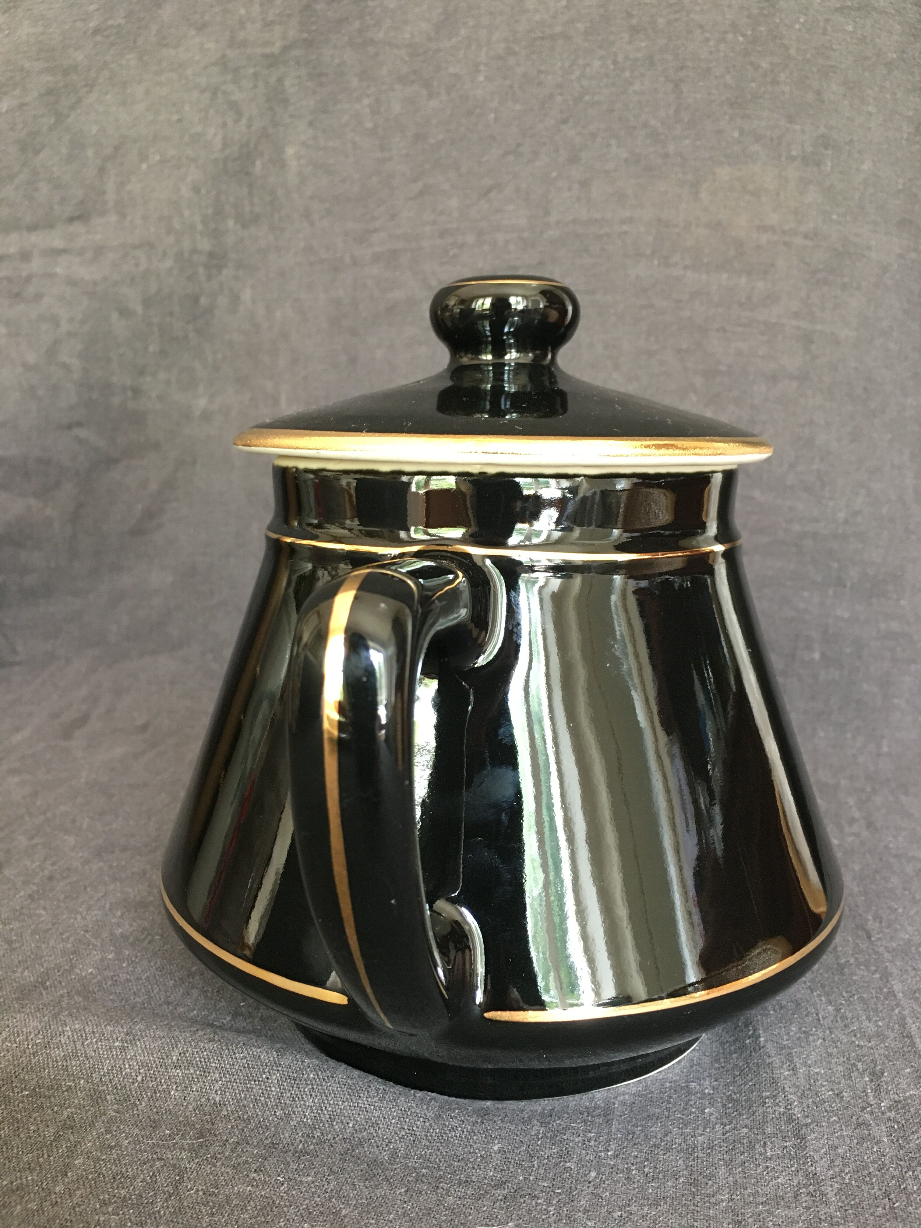 Black and gold ceramic coffee maker