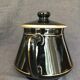 Black and gold ceramic coffee maker